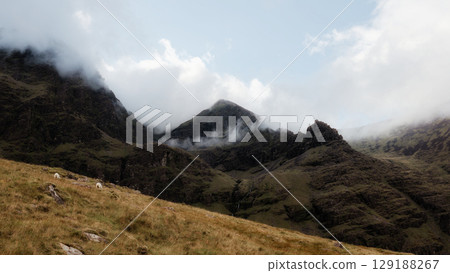Ascending carrauntoohill mountain on a cloudy day in county kerry, ireland. 129188267