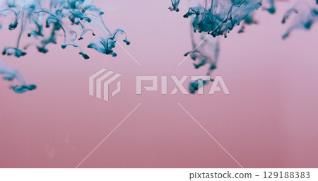 Blur color drip. Smoke splash. Turquoise blue dye blobs in defocused pink fluid. Paint pigment blend flow abstract background free space. Blur color drip. Smoke splash. Turquoise blue dye blobs in defocused pink fluid. Paint pigment blend flow abstract background free space. 129188383