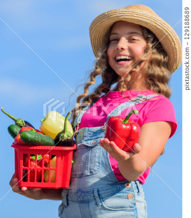 Enjoy your meal. harvest vitamin. spring market garden. little girl vegetable in basket. Only natural. happy little farmer. autumn harvest. kid on summer farm. Organic food. healthy food for children 129188689
