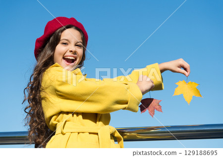 Autumn bucket list for children. Clear sky and good weather. Inspiring fall. Ideas for autumn leisure. Little girl adore autumn season. Kid hold maple leaves. Small girl wear fall outfit outdoors Autumn bucket list for children. Clear sky and good weather. Inspiring fall. Ideas for autumn leisure. Little girl adore autumn season. Kid hold maple leaves. Small girl wear fall outfit outdoors 129188695