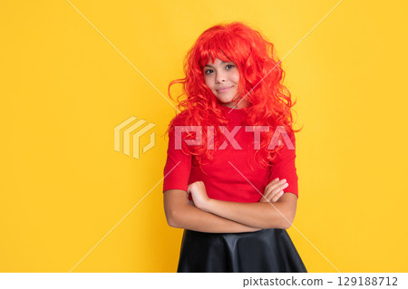 smiling teen kid with red long hair on yellow background smiling teen kid with red long hair on yellow background 129188712