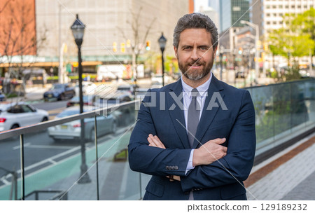 Businessman before business successful meeting in city. Business success of businessman. Businessman in suit. Top manager, politic. Rich man in suit. Business success man outdoor. Business district 129189232