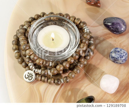 Self-care, healing card with rosary beads, candle and chakra stones on a pink marble tray on a white background. Concept of Me time, relax, no depression, energy healing and meditation Self-care, healing card with rosary beads, candle and chakra stones on a pink marble tray on a white background. Concept of Me time, relax, no depression, energy healing and meditation 129189708