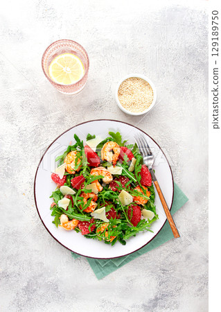 Fresh shrimp salad with arugula, grapefruit, and parmesan served in a bowl Fresh shrimp salad with arugula, grapefruit, and parmesan served in a bowl 129189750