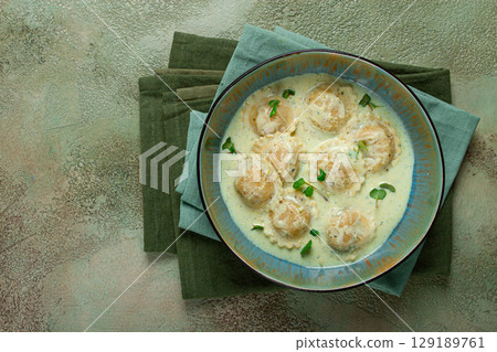 ravioli in cream sauce, spices and herbs, top view, no people, ravioli in cream sauce, spices and herbs, top view, no people, 129189761