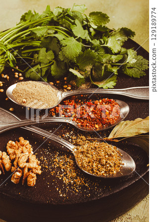 Georgian spices in spoons, on ketsi, top view, no people, 129189774