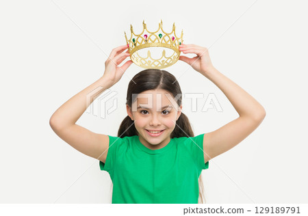Behaving like princess is work. Kid wear golden crown symbol of princess. Girl cute child wear crown. Childhood concept. Every girl dreaming to become princess. Lady little princess. Royal family Behaving like princess is work. Kid wear golden crown symbol of princess. Girl cute child wear crown. Childhood concept. Every girl dreaming to become princess. Lady little princess. Royal family 129189791