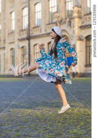 Students life. Teen girl jumping back to school. Knowledge day. Education in school. Girl student jump outdoor. September 1. Time to study. Knowledge and education. School education. Graduated 129189866