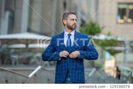 Office manager man in the street. Businessman in suit. Hispanic businessman outdoor. Business boss man. Leadership and success. Successful business. Success of entrepreneur. Strategic manager Office manager man in the street. Businessman in suit. Hispanic businessman outdoor. Business boss man. Leadership and success. Successful business. Success of entrepreneur. Strategic manager 129190078