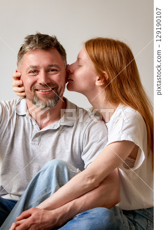 Happy couple sharing a joyful moment together at home 129190107