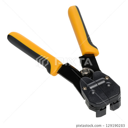 Close up of hand held wire stripper tool with yellow and black handles placed on isolated background Close up of hand held wire stripper tool with yellow and black handles placed on isolated background 129190283
