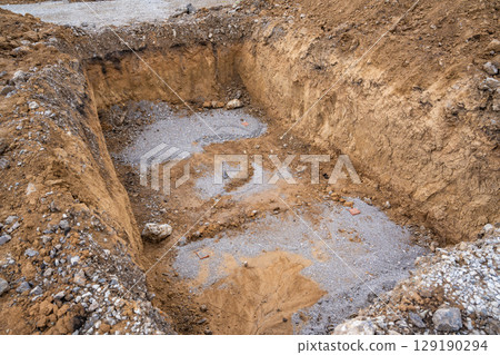 Plate load test results visible on soil surface after static pressure application. Ground investigation for foundation suitability and load-bearing capacity 129190294