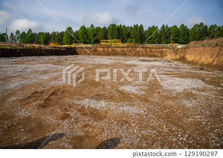 Cleared construction site prepared for building foundation. Excavation area ready for new architectural development and structural work 129190297