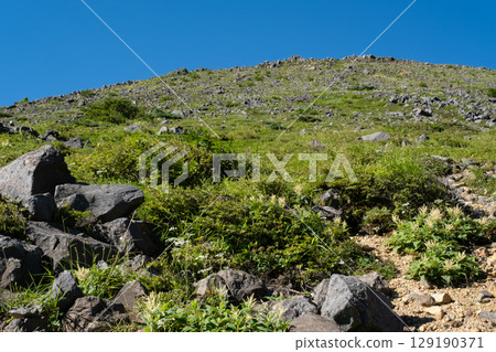 Mount Nasu, Tochigi Prefecture: View of the summit of Mount Chausu from the hiking trail Mount Nasu, Tochigi Prefecture: View of the summit of Mount Chausu from the hiking trail 129190371