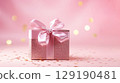 Holiday pink background with gift with satin bow. Valentine's Day, Women's Day, Mother's Day, Wedding, Christmas 129190481
