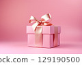 Holiday pink background with gift with satin bow. Valentine's Day, Women's Day, Mother's Day, Wedding, Christmas 129190500