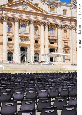 Rows of church chairs in St. Peter's Square with St. Peter's Basilica in the background, Rome, Italy 129190546