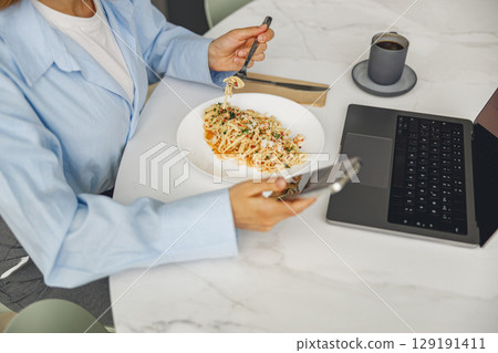 Enjoy a modern work lunch featuring delicious noodles combined with cuttingedge technology Enjoy a modern work lunch featuring delicious noodles combined with cuttingedge technology 129191411