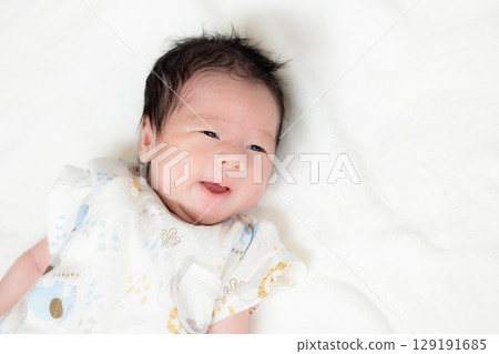 Newborn baby taking a nap Newborn baby taking a nap 129191685