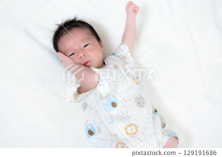 Newborn baby taking a nap Newborn baby taking a nap 129191686