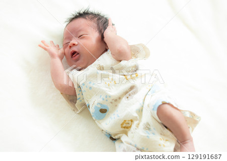 Newborn baby taking a nap Newborn baby taking a nap 129191687
