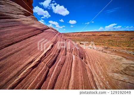 Sandstone Striations and Desert Vegetation under Blue Sky Beehive Trail Arizona 129192049