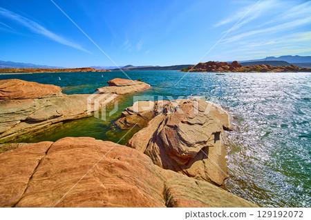Red Sandstone and Blue Lake Water in Motion Sand Hollow State Park Eye Level View Red Sandstone and Blue Lake Water in Motion Sand Hollow State Park Eye Level View 129192072