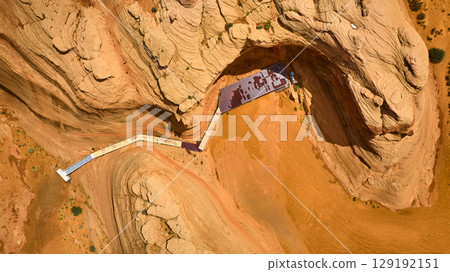Aerial Red Rock Canyon Walkway with Striated Sandstone Formations Top Down View 129192151