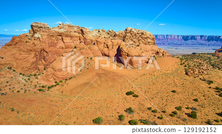 Aerial Vermilion Cliffs Red Rock Formation and Desert Valley Fly Over Aerial Vermilion Cliffs Red Rock Formation and Desert Valley Fly Over 129192152