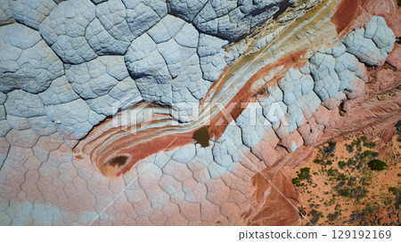 Aerial White Pocket Sandstone Patterns and Desert Terrain Top Down View 129192169
