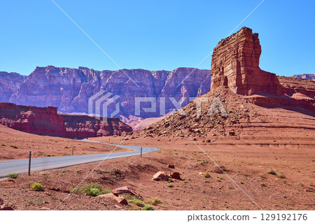 Red Sandstone Butte and Winding Desert Road in Arizona Southwest Eye Level Red Sandstone Butte and Winding Desert Road in Arizona Southwest Eye Level 129192176