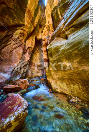 Sandstone Slot Canyon Stream Motion with Vertical Walls Low Perspective Sandstone Slot Canyon Stream Motion with Vertical Walls Low Perspective 129192364