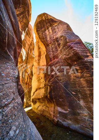 Sandstone Slot Canyon Walls Sunlit Striations Skyward Motion Perspective 129192469