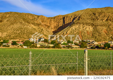 Suburban Homes and Farmland at Desert Cliffs Edge Eye Level View Suburban Homes and Farmland at Desert Cliffs Edge Eye Level View 129192475