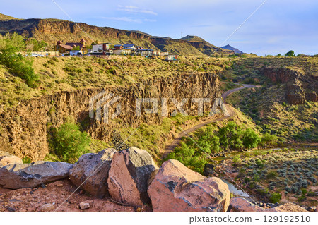 Desert Canyon Cliffs with Suburban Homes and Winding Road Eye Level Overlook Desert Canyon Cliffs with Suburban Homes and Winding Road Eye Level Overlook 129192510