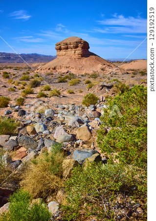 Desert Mesa and Rugged Terrain Under Blue Sky Eye-Level View Desert Mesa and Rugged Terrain Under Blue Sky Eye-Level View 129192519