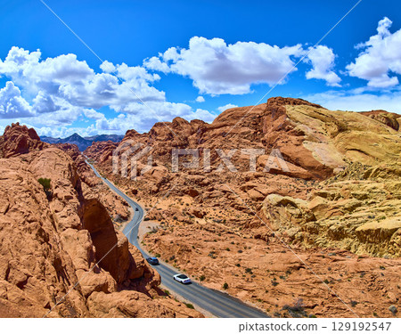 Desert Road Through Red Sandstone Formations in Moapa Valley Aerial 129192547
