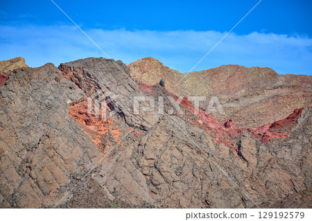 Rugged Desert Mountains with Vibrant Layers Eye Level Perspective Rugged Desert Mountains with Vibrant Layers Eye Level Perspective 129192579