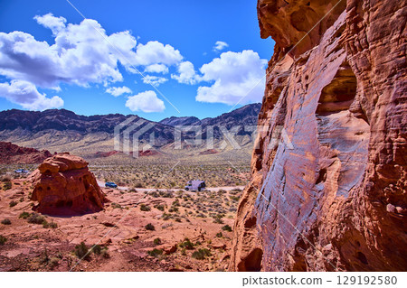 Desert Road Adventure with Red Rock Formations Aerial Perspective Desert Road Adventure with Red Rock Formations Aerial Perspective 129192580