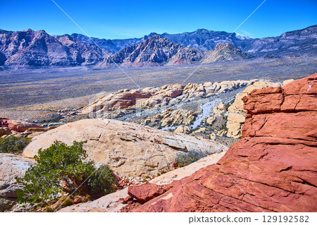 Red Rock Canyon Sandstone Formations with Mountains Aerial Perspective 129192582