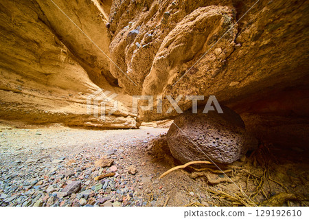 Majestic Rock Formations and Gravel in Sunlit Desert Low Ground View 129192610