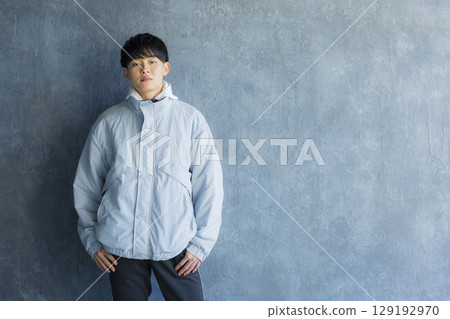 Young man using smartphone in bed 129192970
