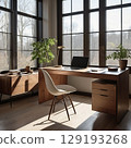 A laptop computer is placed on a desk in an office with natural morning light. 129193268