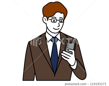 A man wearing glasses and a brown suit looking at his smartphone 129193271