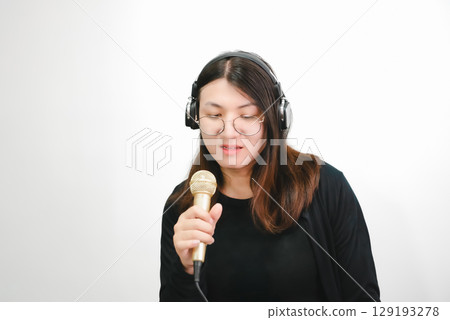 Woman (LGBTQ) singer sing a song with microphone 129193278