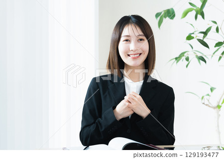 A young woman engaged in sales activities A young woman engaged in sales activities 129193477