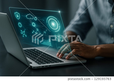 AI generated ultra realistic scene of hand using laptop with glowing holographic interface showing charts icons and digital elements in modern tech environment 129193763