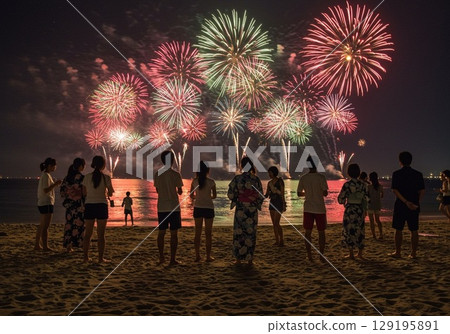 穿著泳衣的情侶在海灘欣賞煙火 穿著泳衣的情侶在海灘欣賞煙火 129195891