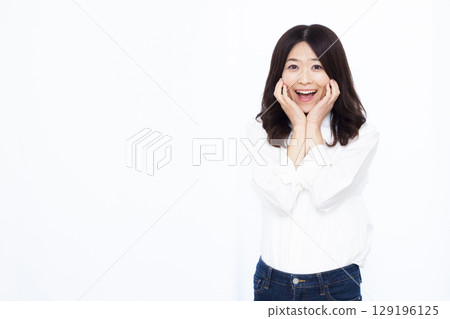 A woman smiling and surprised 129196125