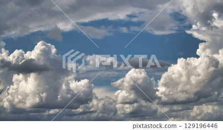 A beautiful view of clouds and a blue sky, perfect for backgrounds. A beautiful view of clouds and a blue sky, perfect for backgrounds. 129196446